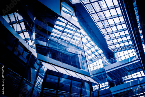 Low Angle View Of Glass Roof of modern building in blue tone.