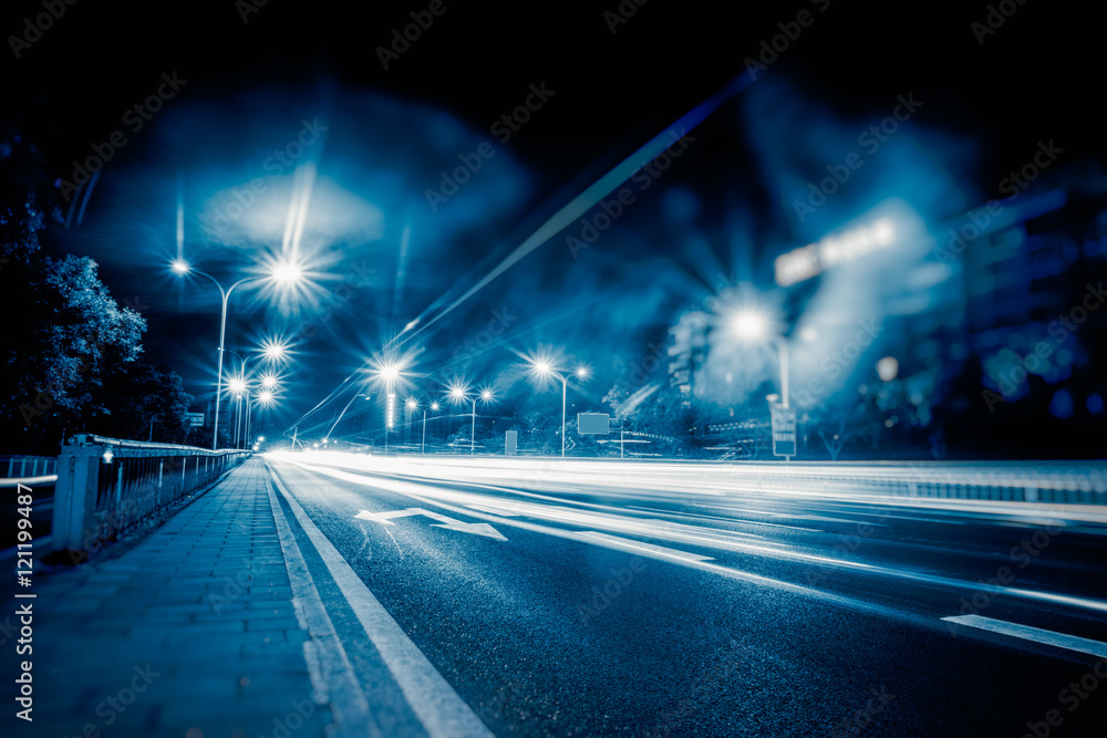 blurred traffic light trails on road in Beijing,China. blurred traffic light trails on road in Beijing,China.