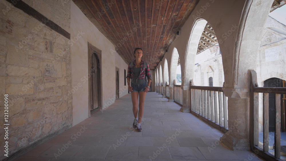 Tourist travels in Europe, sightseeing tour. A woman with backpack.