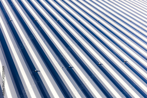 corrugated metal sheet roof background texture in sunlight