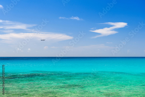 airplane landing over the sea
