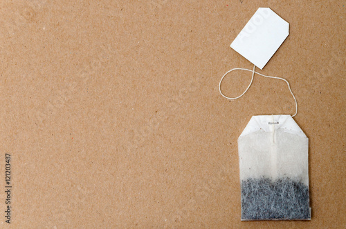 New Bag of tea on old broun background with copy space 