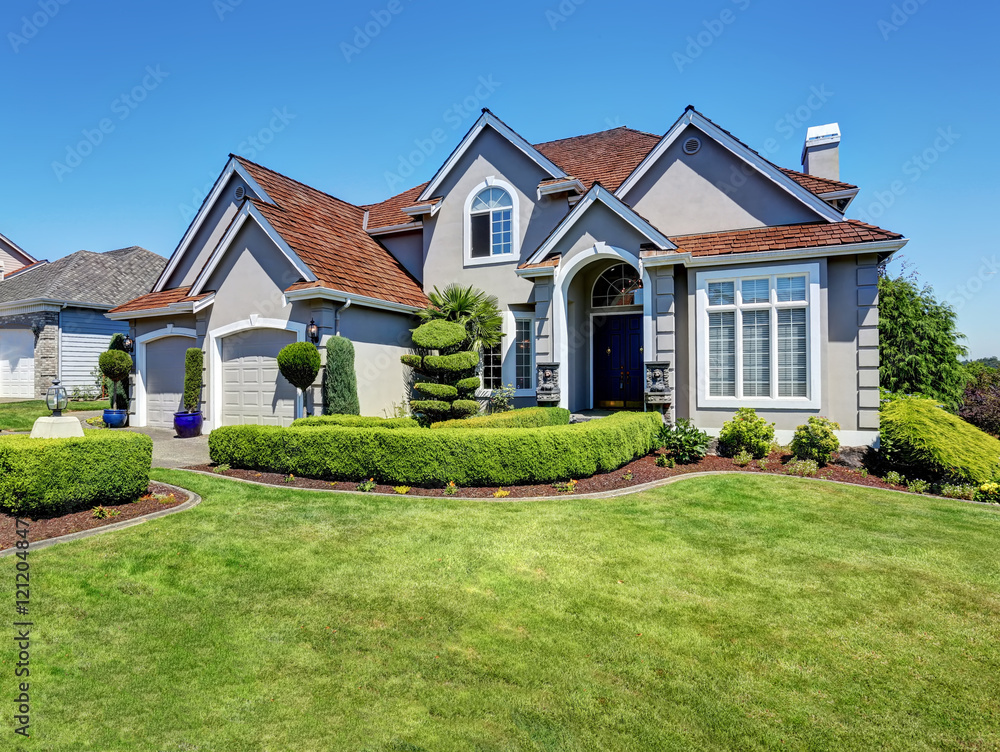 Luxury residential house with perfectly kept front garden. Luxury residential house with perfectly kept front garden.