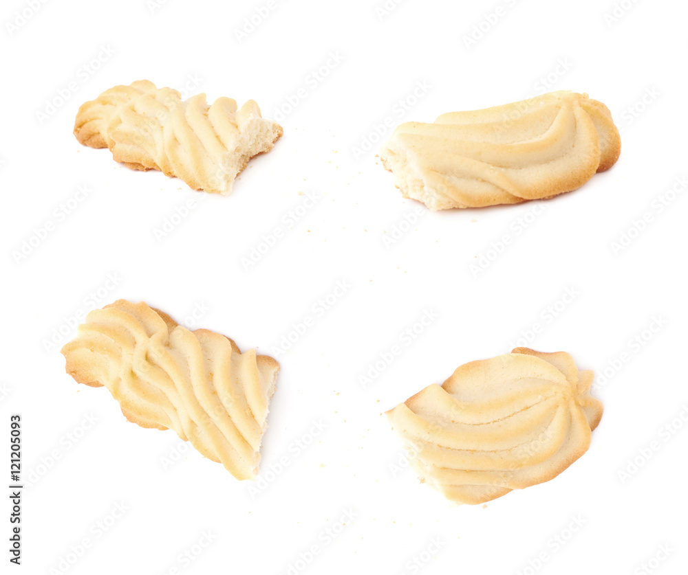Broken into pieces cookie isolated over the white background Broken into pieces cookie isolated over the white background