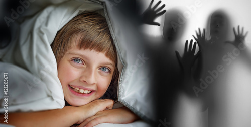 little girl sleaping in a bed - halloween ghosts photo