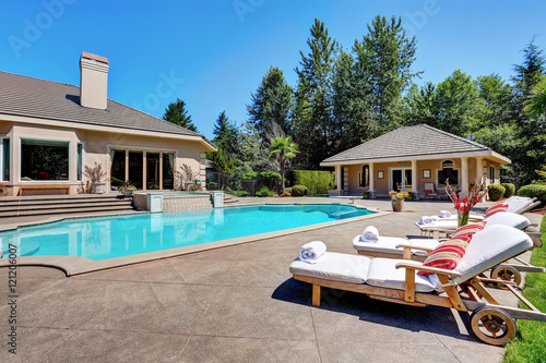 Great backyard with swimming pool. American Suburban luxury house © Iriana Shiyan