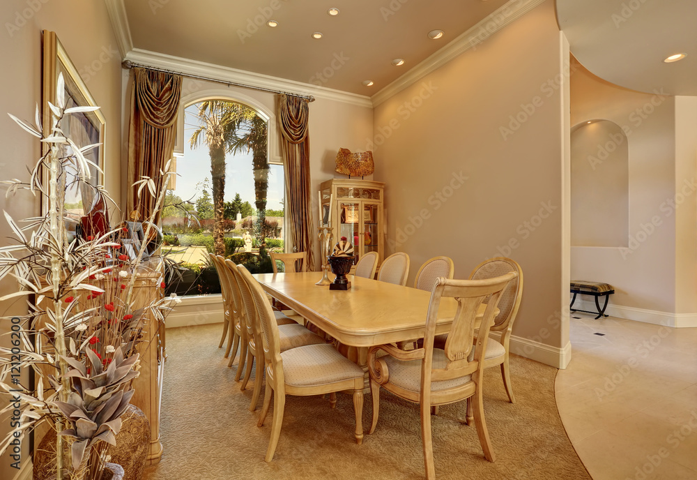 Luxury beige dining room interior with large window