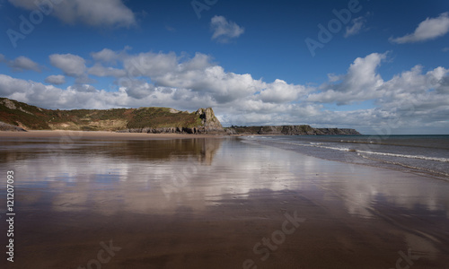 Fototapeta Naklejka Na Ścianę i Meble -  Great Tor refection
Low tide creates a reflection of the Great Tor in South Gower, South Wales