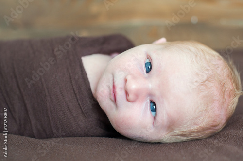 Фотография Temporary strabismus newborn baby