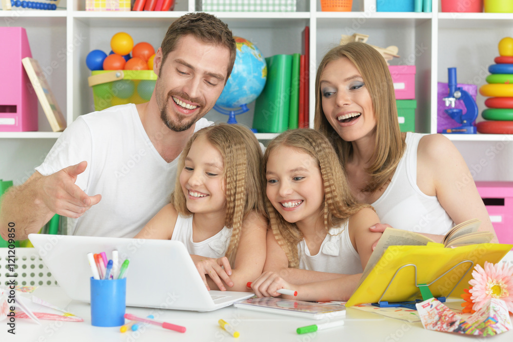 Fototapeta premium happy family with laptop