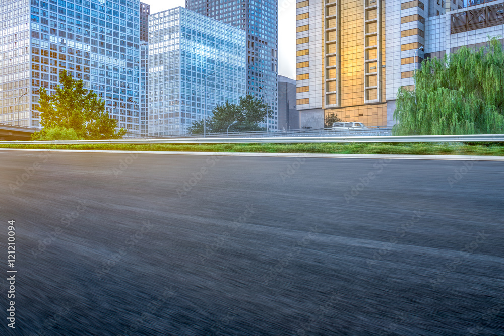 empty asphalt road through modern city in China. empty asphalt road through modern city in China.