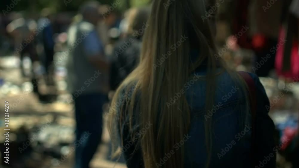 Attractive young blonde woman walking on the street Attractive young blonde woman walking on the street