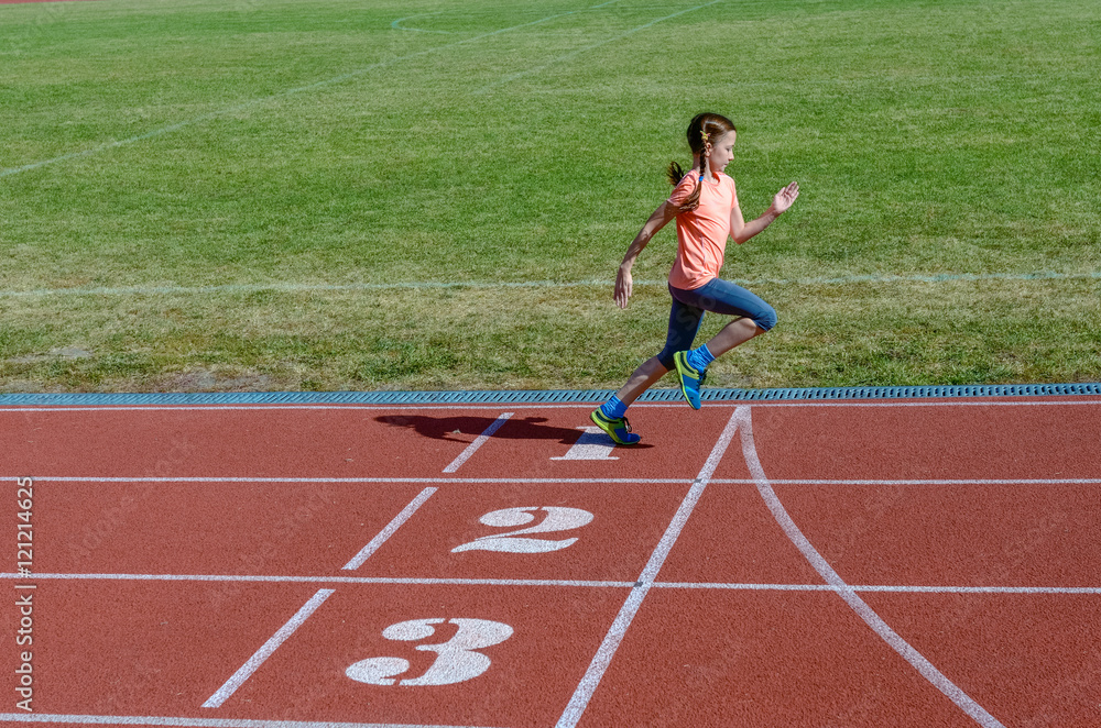 Kids sport, child running on stadium track, training and fitness concept
