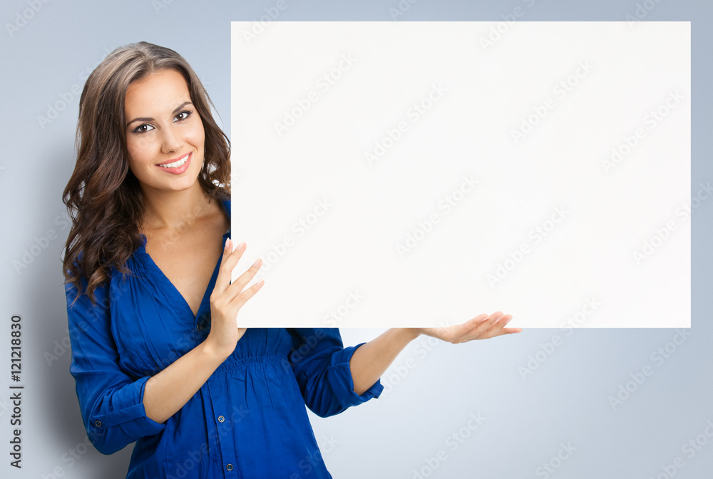 Beautiful young woman showing blank signboard Beautiful young woman showing blank signboard