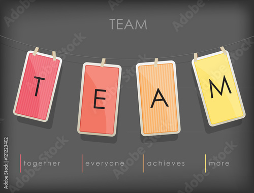 Word spell "TEAM" on hanging note paper with rope.
