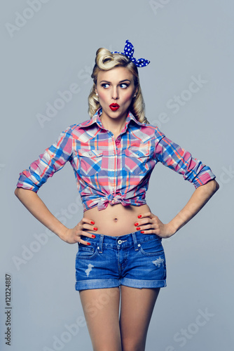  young surprised woman, dressed in pin-up style © vgstudio