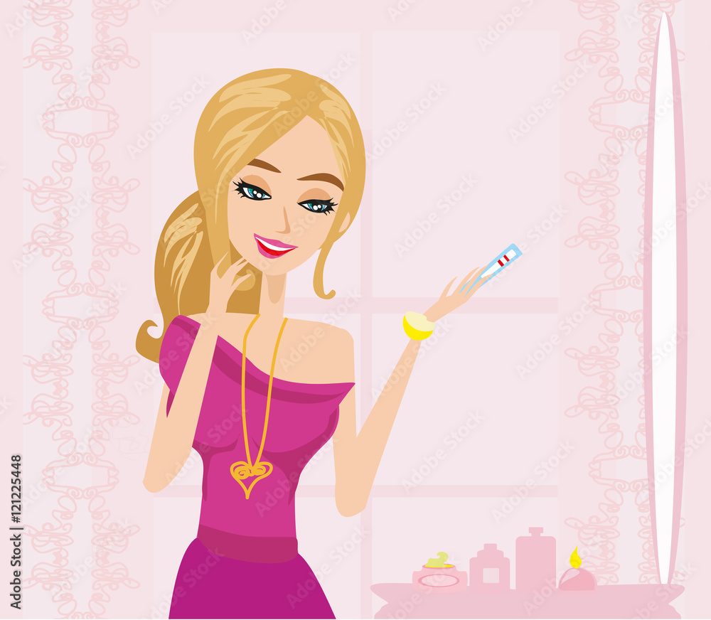 Smiling young woman looking on pregnancy test Smiling young woman looking on pregnancy test