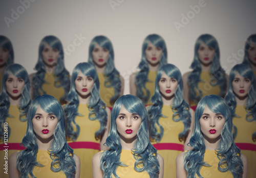 Many Glamour Beauty Woman Clones. Identical Crowd Concept. photo