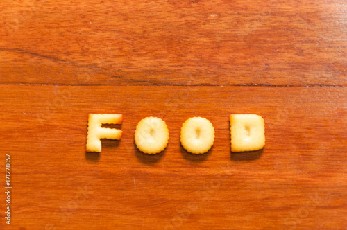 the word food written with cracker