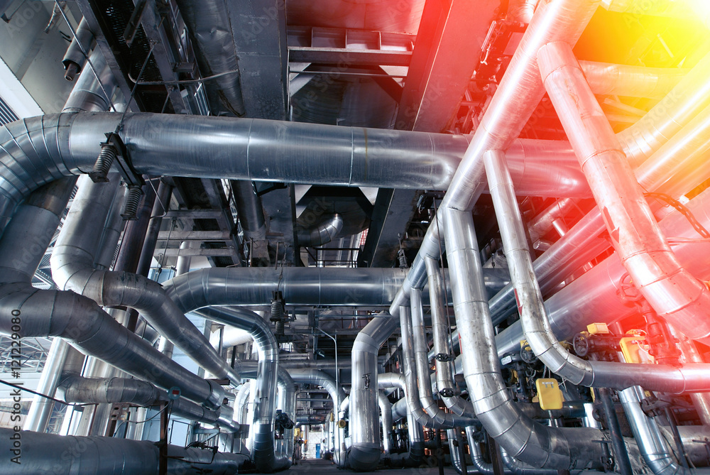 Equipment, cables and piping as found inside of a modern industr Equipment, cables and piping as found inside of a modern industr