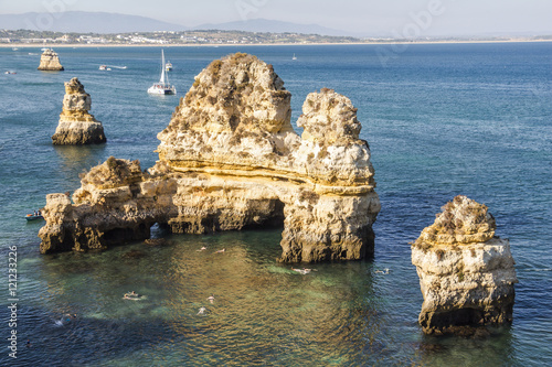 Rocks in water at Lagos, Algarve region, Portugal photo