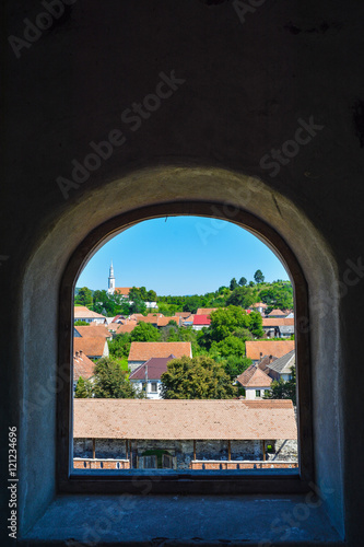 Beautiful view over Racos village from the citadel tower through the window  in Romania