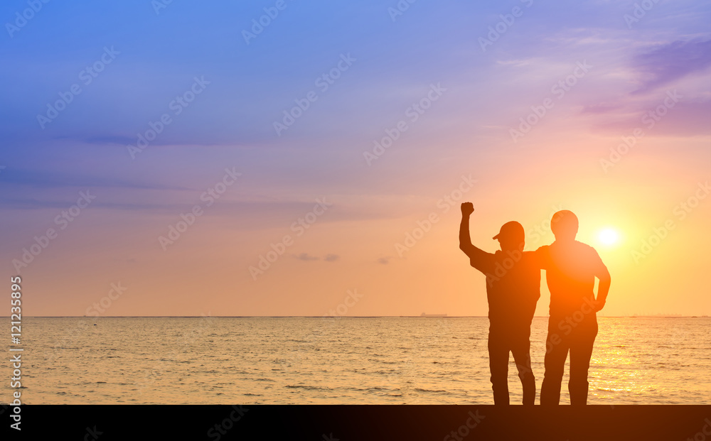 Silhouette man or businessman wiith friend celebrities togeter for Their success on the bridge in front of beautiful sunset and ocean and boat to success, challenge, motivation, achievement, goal