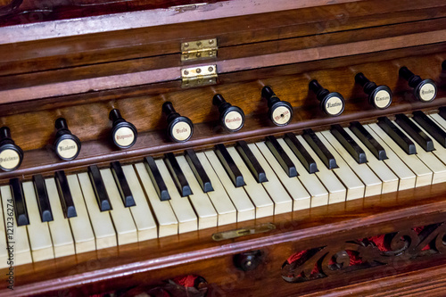 Close-up of antique reed organ harmonium
