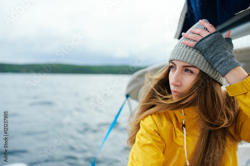 Young woman sailing the boat