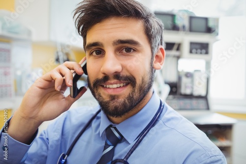 Doctor talking on mobile phone