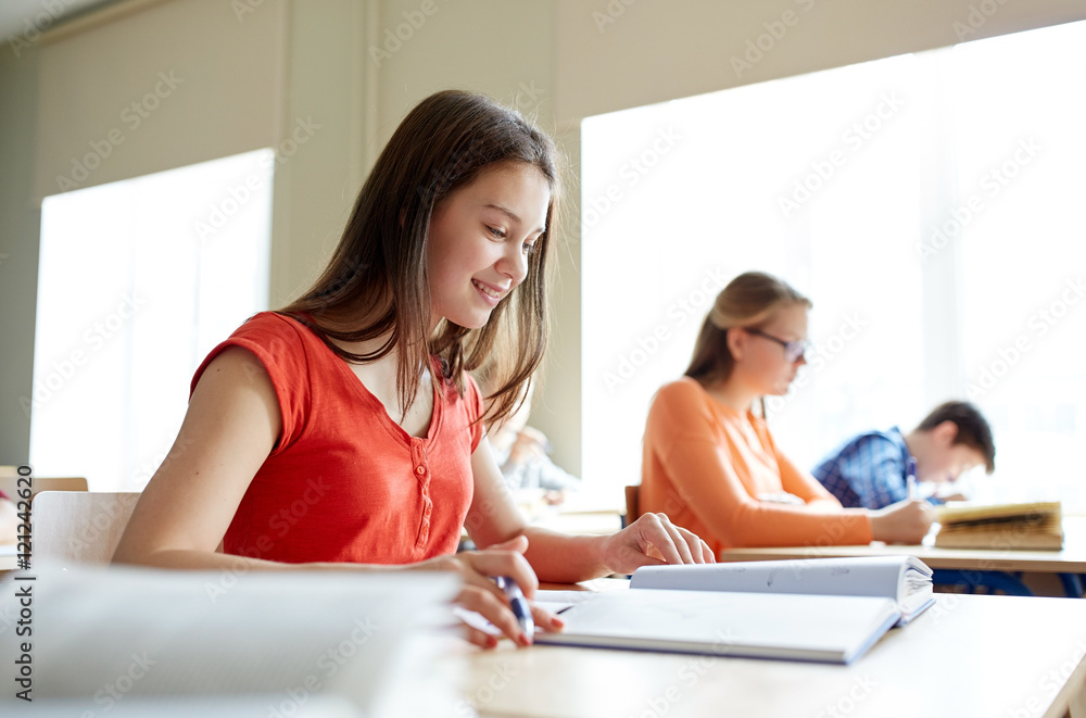 happy student girl with book writing school test happy student girl with book writing school test