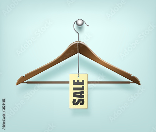 Clothes Coat Wooden Hanger with Sale Tag Label on Background