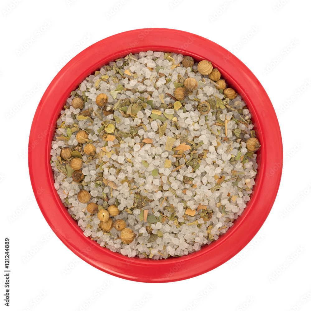 Moroccan blend of spices in a red bowl top view isolated on a white background. Moroccan blend of spices in a red bowl top view isolated on a white background.