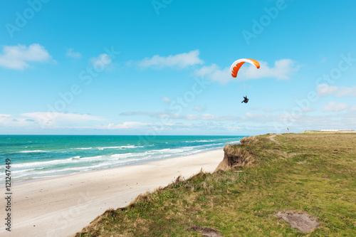 Paragliding on the deserted beach