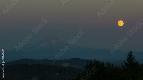 Ultra high definition 4k time lapse movie of full moon rising over Mount Hood and city of Happy Valley Oregon from sunset into blue hour during harvest festival in August 4096x2304 photo
