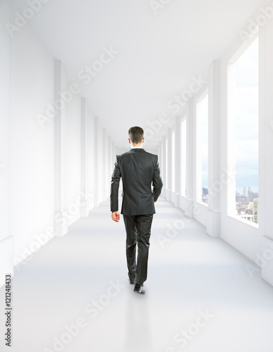 Man walking in corridor interior