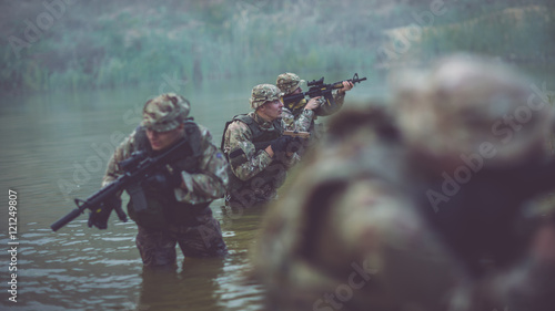 special forces soldiers with weapon take part in military maneuv