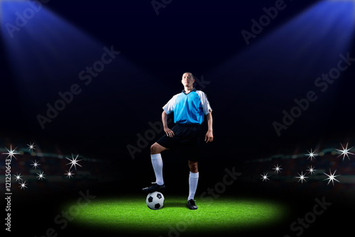 Soccer player with ball on field of stadium © pongsakorn_jun26