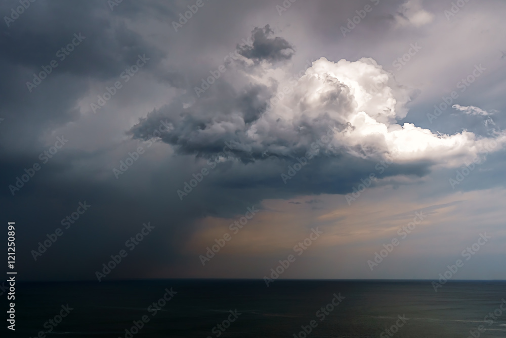 rain and stormy cloud over sea