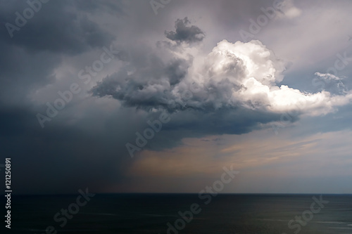 rain and stormy cloud over sea © mimadeo