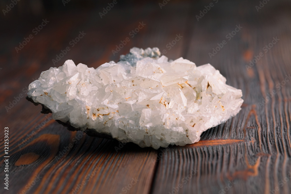white calcite mineral on the wooden background white calcite mineral on the wooden background