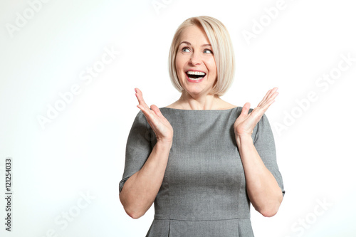 Surprised woman over white background. Human face expression, emotions, feeling attitude reaction