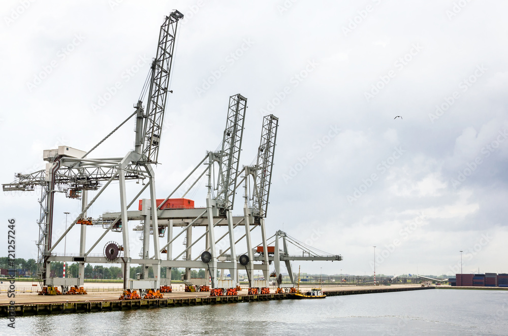 Container Cranes on a Empty Pier and Cloudy Sky