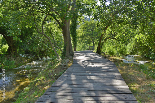 A wooden walkway on the River Krka in Krka National Park, Sibenik-Knin County, © dragoncello