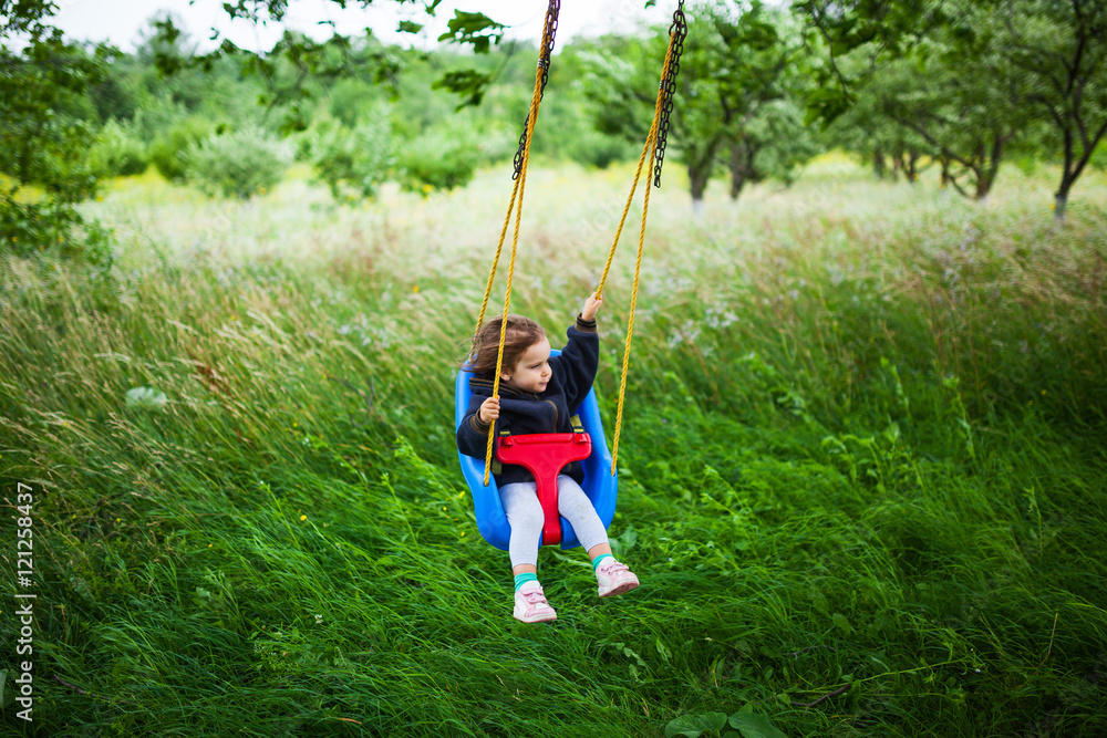  Little girl on a swing
