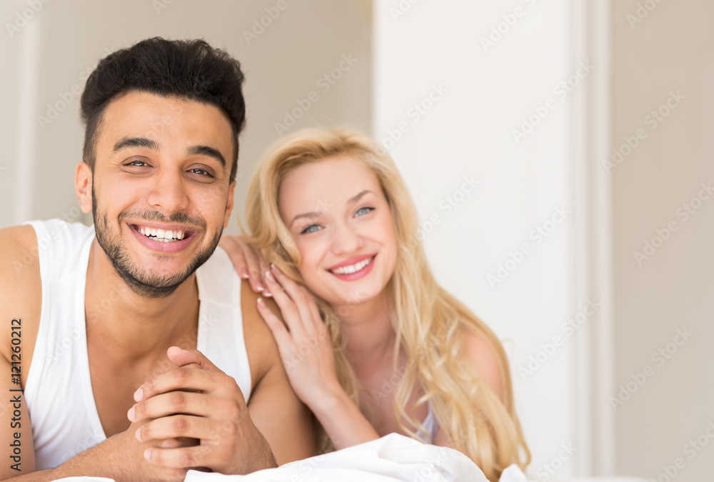 Young Couple Lying In Bed, Happy Smile Hispanic Man And Woman Young Couple Lying In Bed, Happy Smile Hispanic Man And Woman