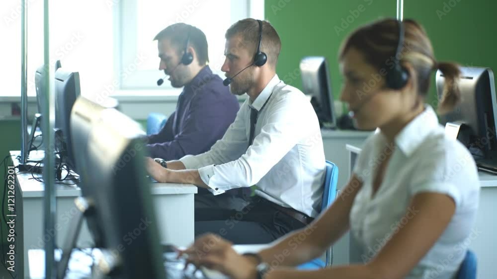 Young businesswoman working in a call center with his colleagues Young businesswoman working in a call center with his colleagues