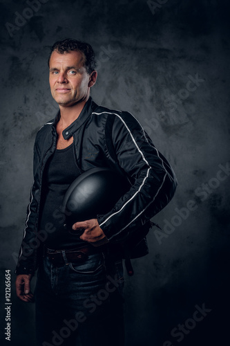 Portrait of middle age biker in sports jacket. © Fxquadro