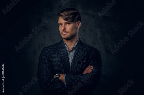 portrait of male on grey background.