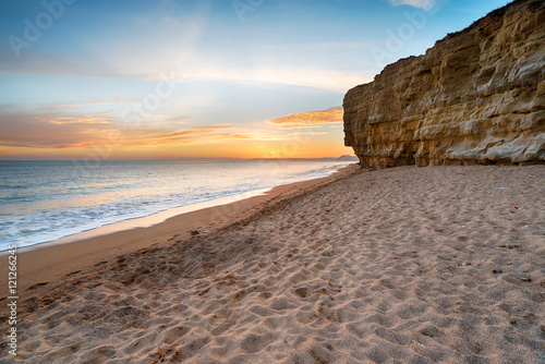 Obraz na plátně Sunset over Hive Beach at cliffs at Burton Bradstock near Bridport on the Dorset